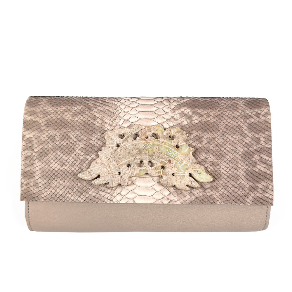 BAGUETTE - PINK NUDE SNAKE by evokewomen, features an embossed snake pattern in beige and brown and is accented with a decorative curved metal clasp on the front.