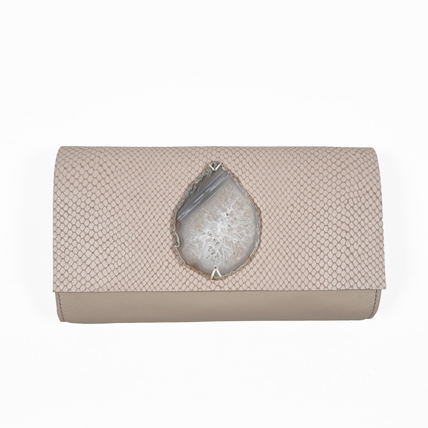 Powder-hued snake embossed leather baguette clutch with crystal white and grey teardrop-shaped agate on white background.