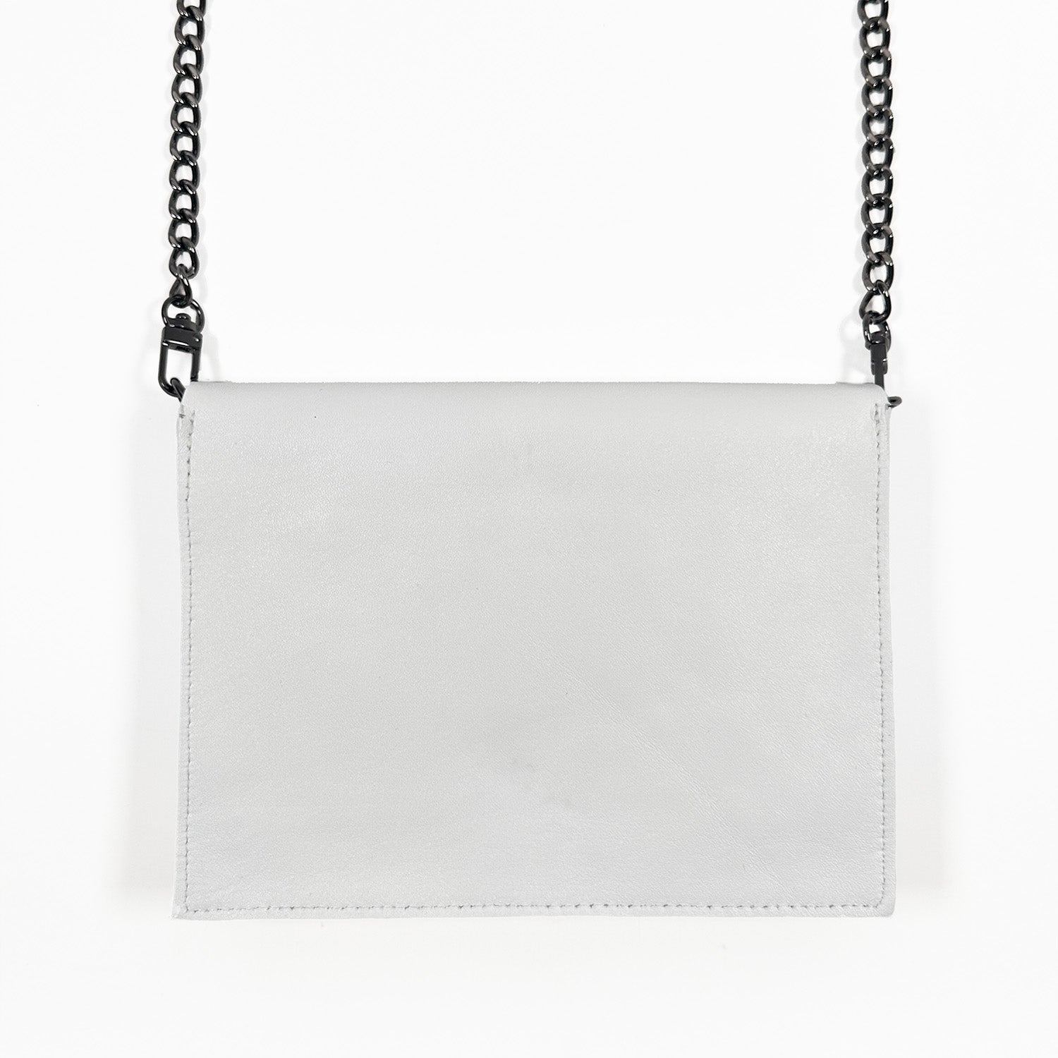 Backside of white leather crossbody bag with a black gunmetal chain strap.