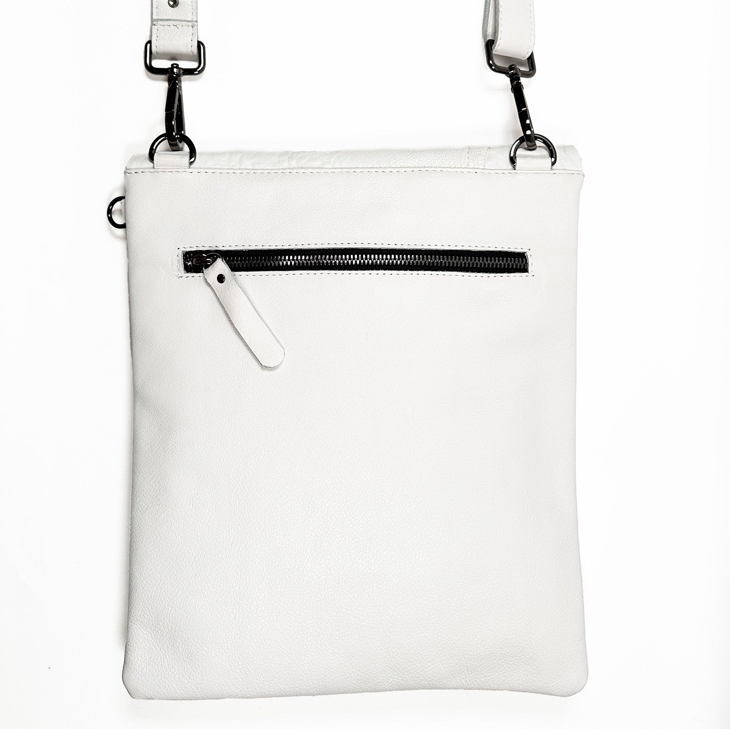 Introducing the DRITA - white, an exquisite Italian leather crossbody bag by evokewomen, showcasing a front zipper pocket and an adjustable strap against a minimalist background.