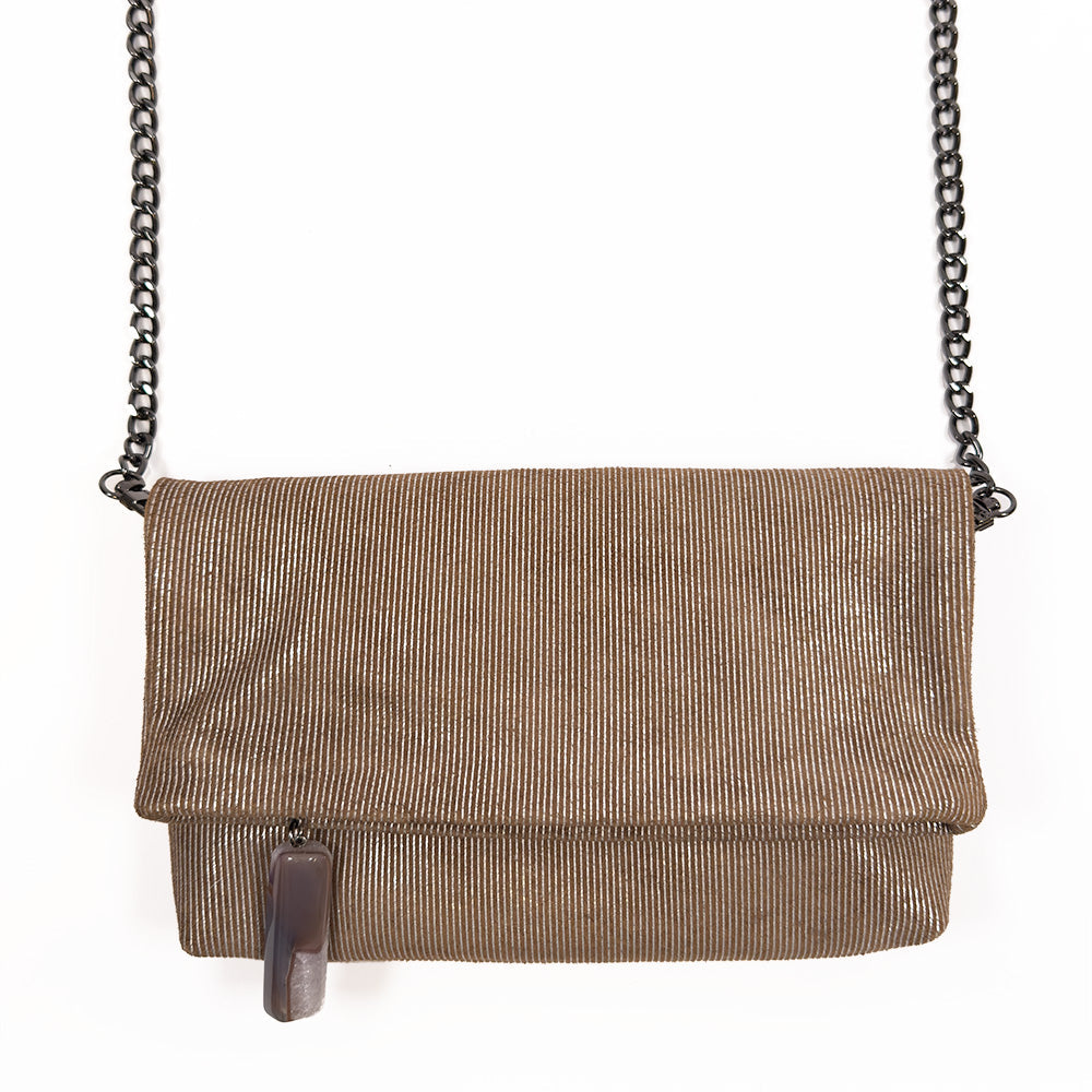 The Farah - nutshell-silver from evokewomen is a versatile accessory featuring a brown textured design and a stylish snake spine chain strap, perfect for elevating any outfit with chic sophistication. Its fold-over flap adds to the allure, echoing the elegance and functionality of the Farah Fold-Over Clutch.