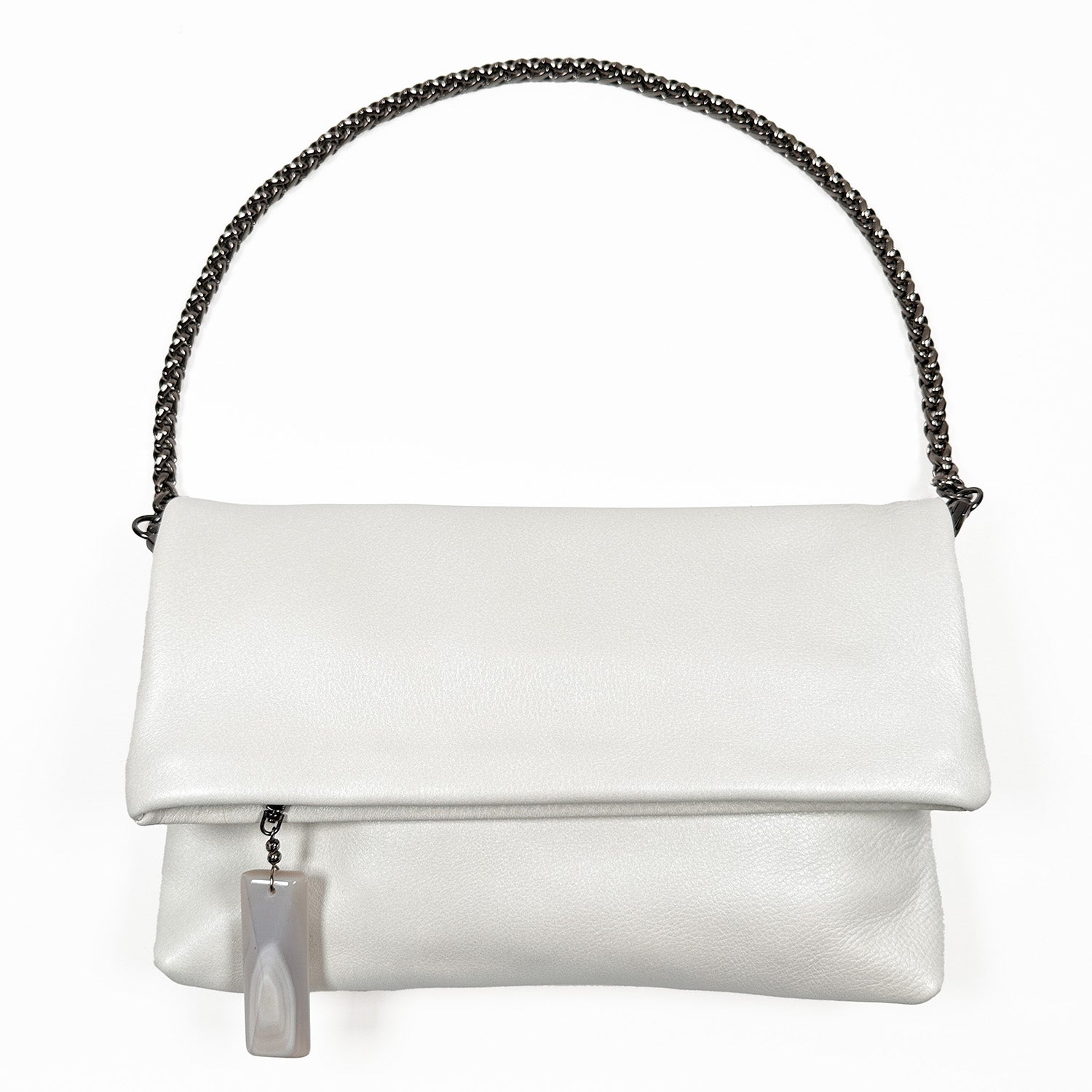 The Farah - pearl white clutch by evokewomen is a versatile accessory made from premium white leather, featuring a fold-over flap and a chic dark metal chain strap. An elegant rectangular stone zipper charm dangles gracefully from the flap's pull, adding an extra layer of sophistication.