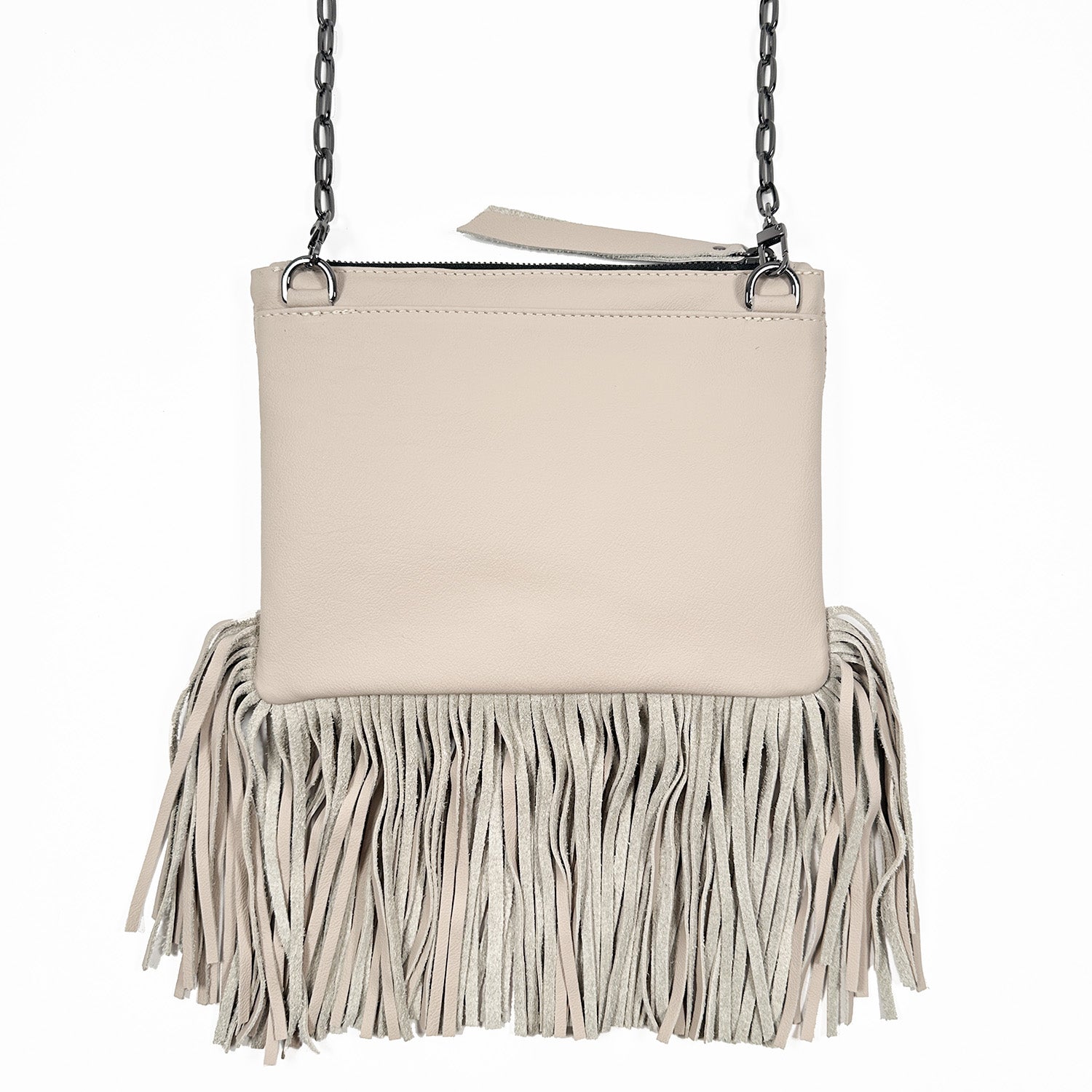 Backside of powder hued fringe bag with zipper closure on white background. Gunmetal cross-body chain.