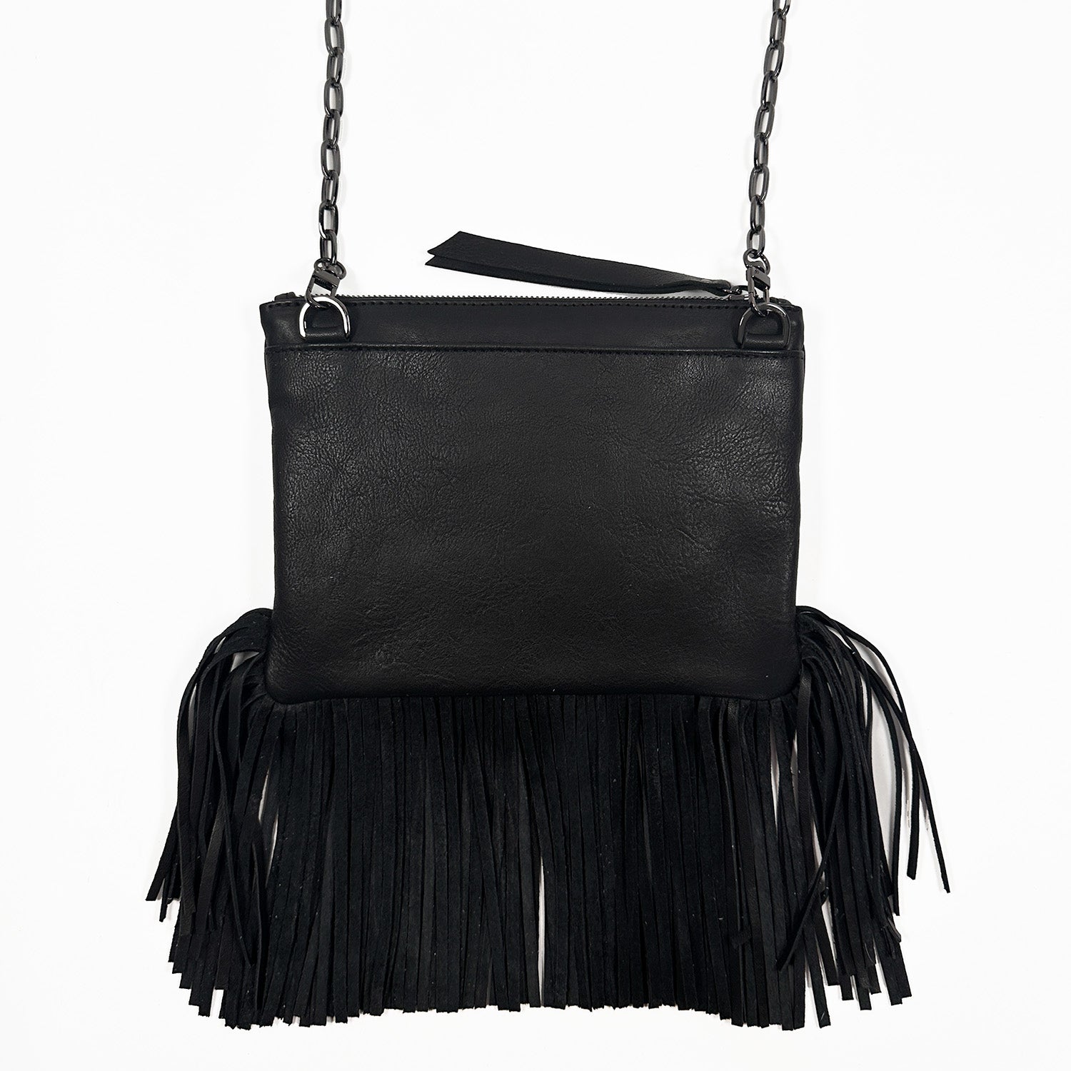 Backside of black fringe bag with zipper closure on white background. Gunmetal cross-body chain.