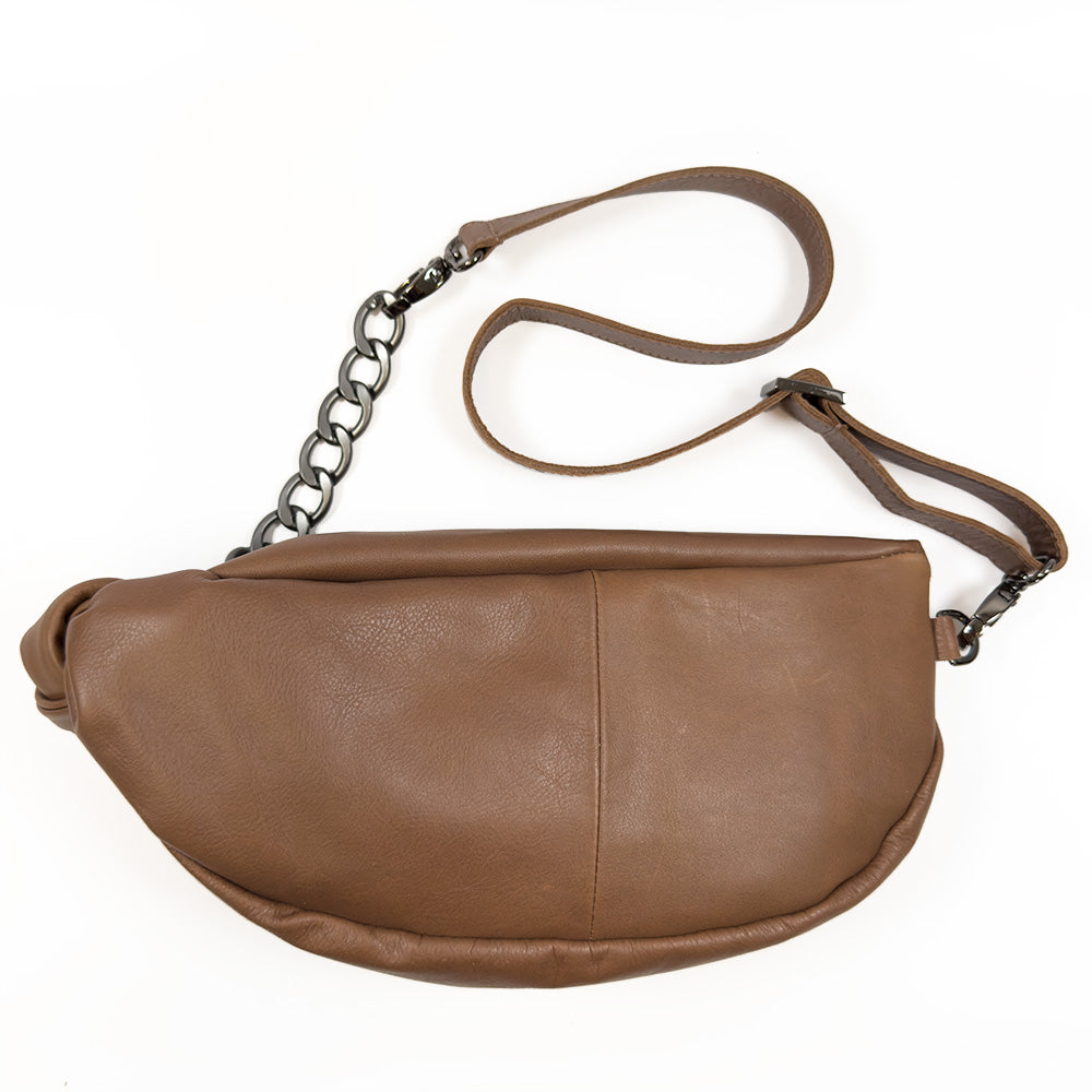 The LONDON - NUTSHELL by evokewomen is a chic brown leather crossbody bag with a chain and leather strap, ideal for those looking for the style and practicality of a London Sling Bag.