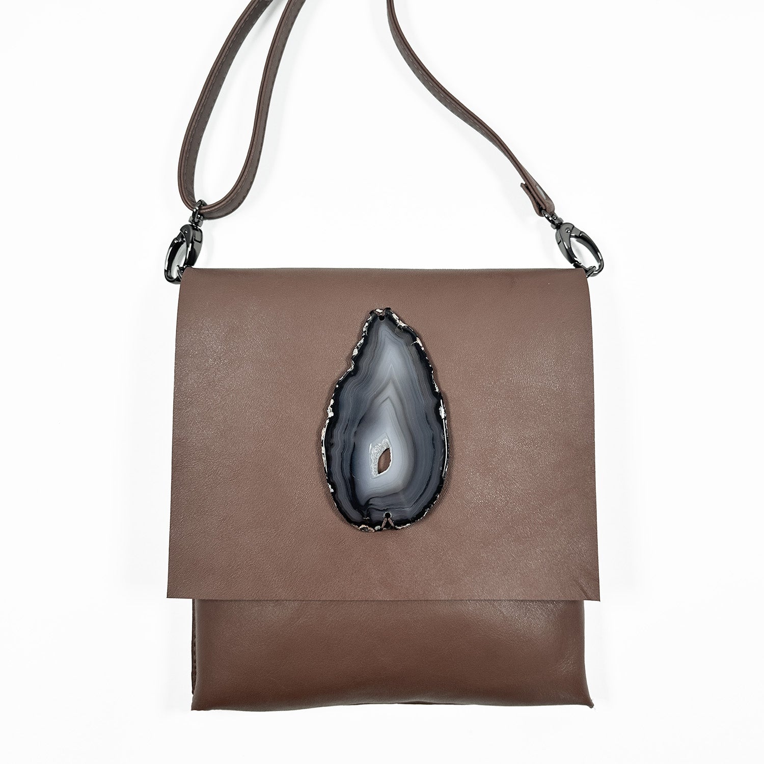 Portrait-style mocha brown Italian leather cross-body bag with a matching leather strap, gunmetal hardware, and an oval agate stone accent, shown against a white background.