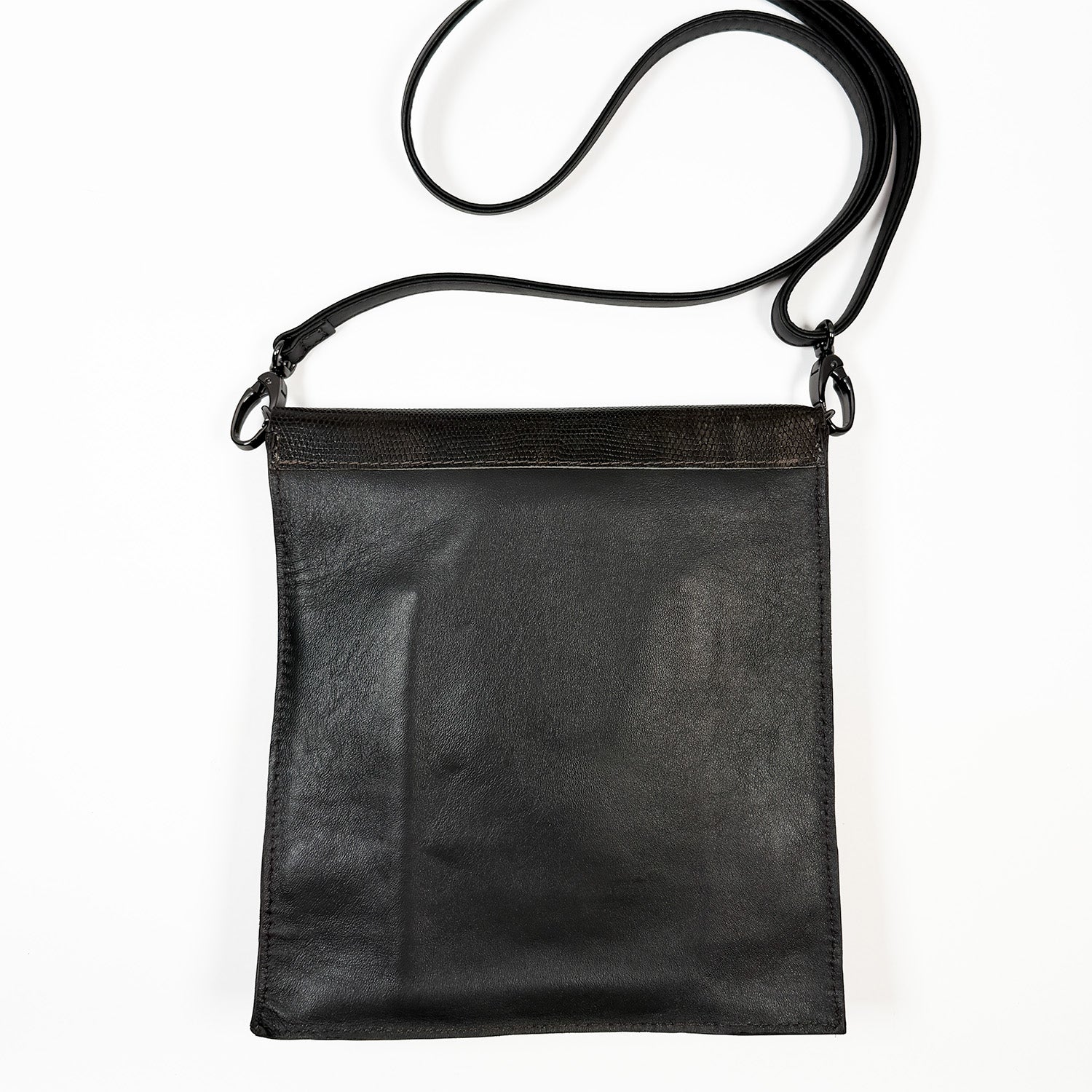 Dark brown leather crossbody bag on a white background