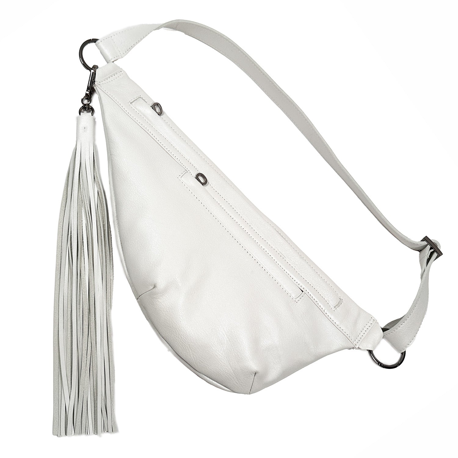 Introducing the Sienna by evokewomen, a chic pearl white leather sling bag. It boasts a long tassel and an adjustable strap, complete with a front zipper pocket and two metal rings to seamlessly blend flair and versatility with any outfit.