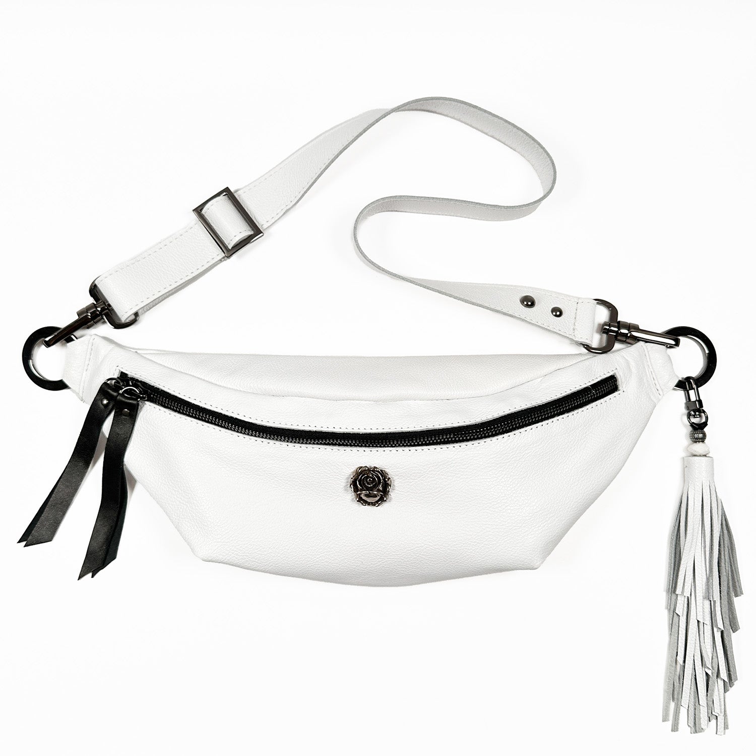 Introducing the STELLA by evokewomen, a luxurious and versatile white sling bag crafted from premium Italian leather. This stylish accessory features a secure zipper closure, an adjustable strap for maximum comfort, and a chic tassel detail on the side.