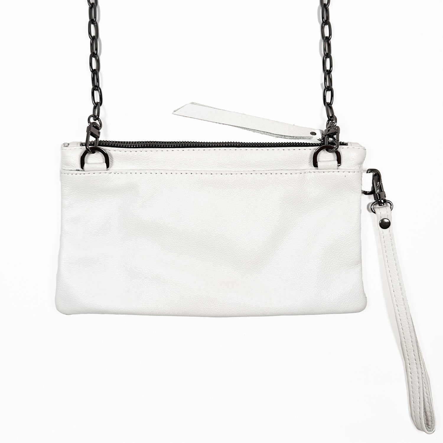 The VICTORIA - white by evokewomen is a versatile handbag crafted from white leather, featuring a black chain strap and wristlet, and can be worn as a crossbody bag with its practical top zipper closure.