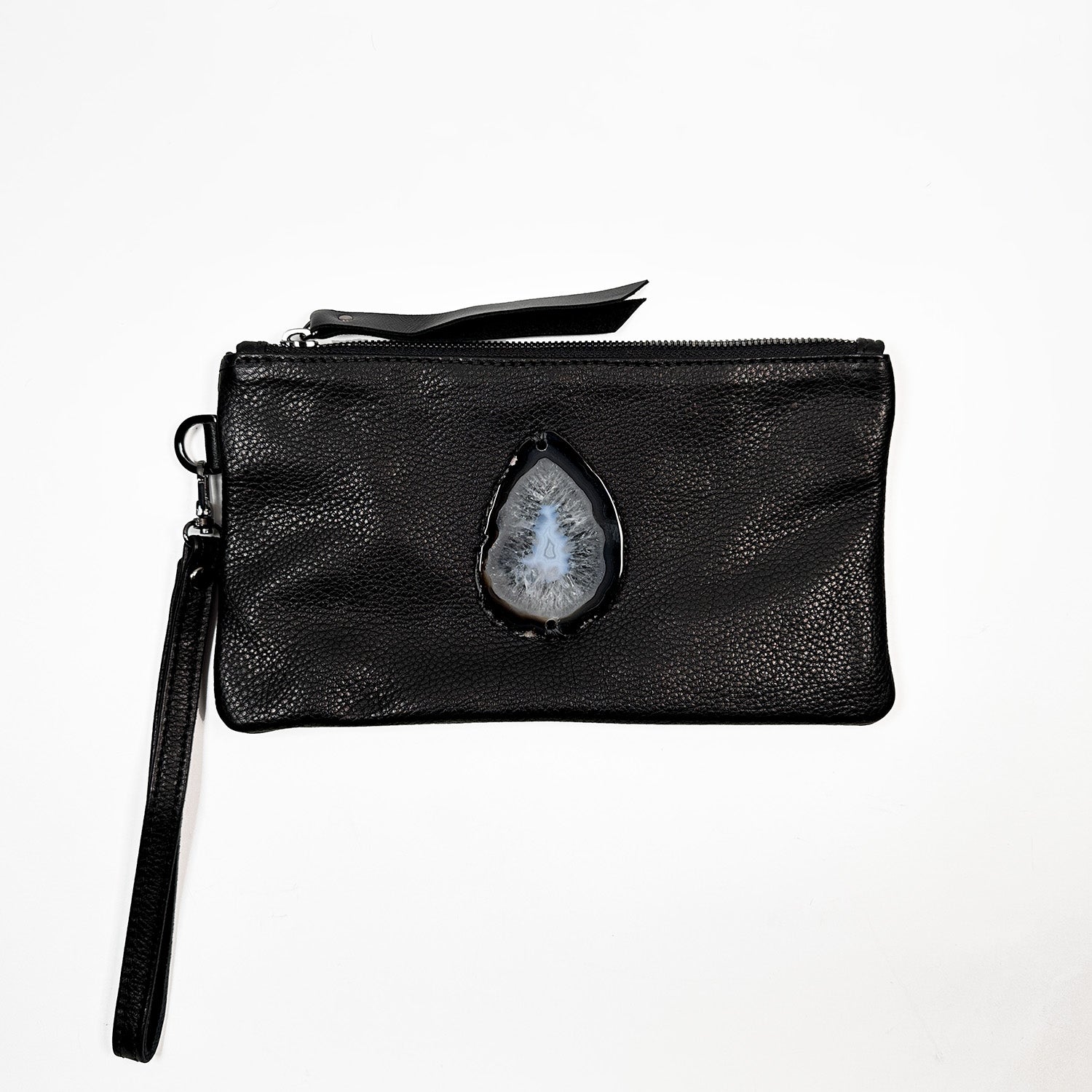 The Victoria Bag in black Italian leather by Evoke Women, featuring a striking agate decoration. This versatile accessory can be worn as a crossbody, belt bag, or wristlet, showcasing a sleek design that transitions effortlessly from day to night.