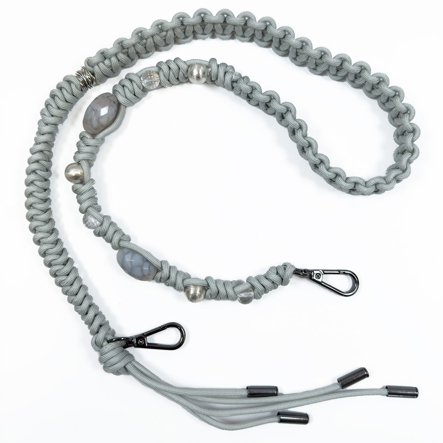 Light smoke braided paracord shoulder strap by evokewomen, featuring gunmetal accessories, decorative beads including faceted agate, and two black metal clips at each end.