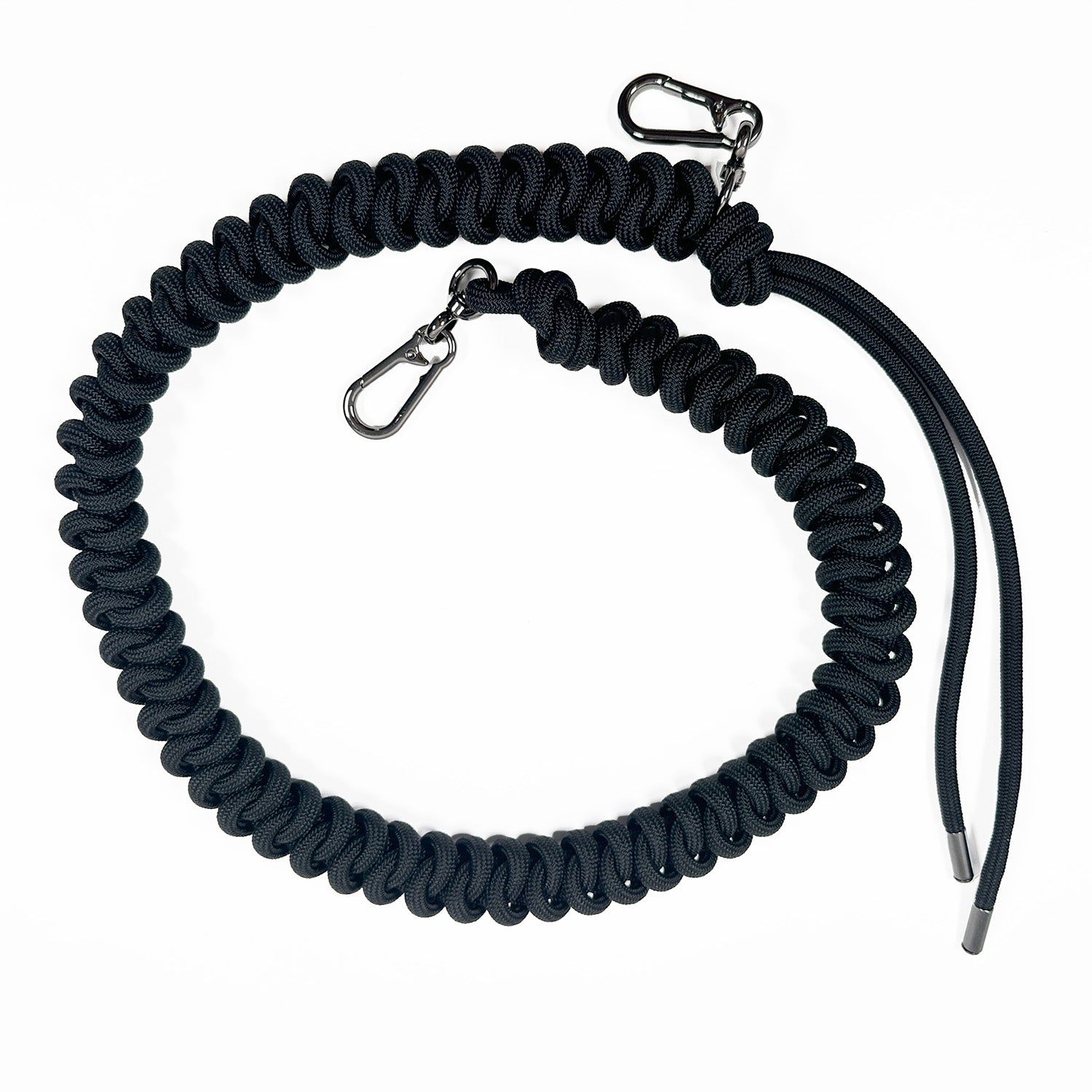 Black knotted paracord strap with 2 high end gunmetal colored swivel hooks and tassel ends on white background.
