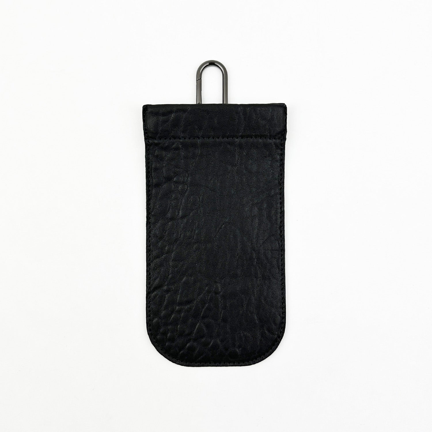 Black bubbly pouch from evokewomen featuring a squeeze frame closure and metal keyring attachment, set against a white backdrop.