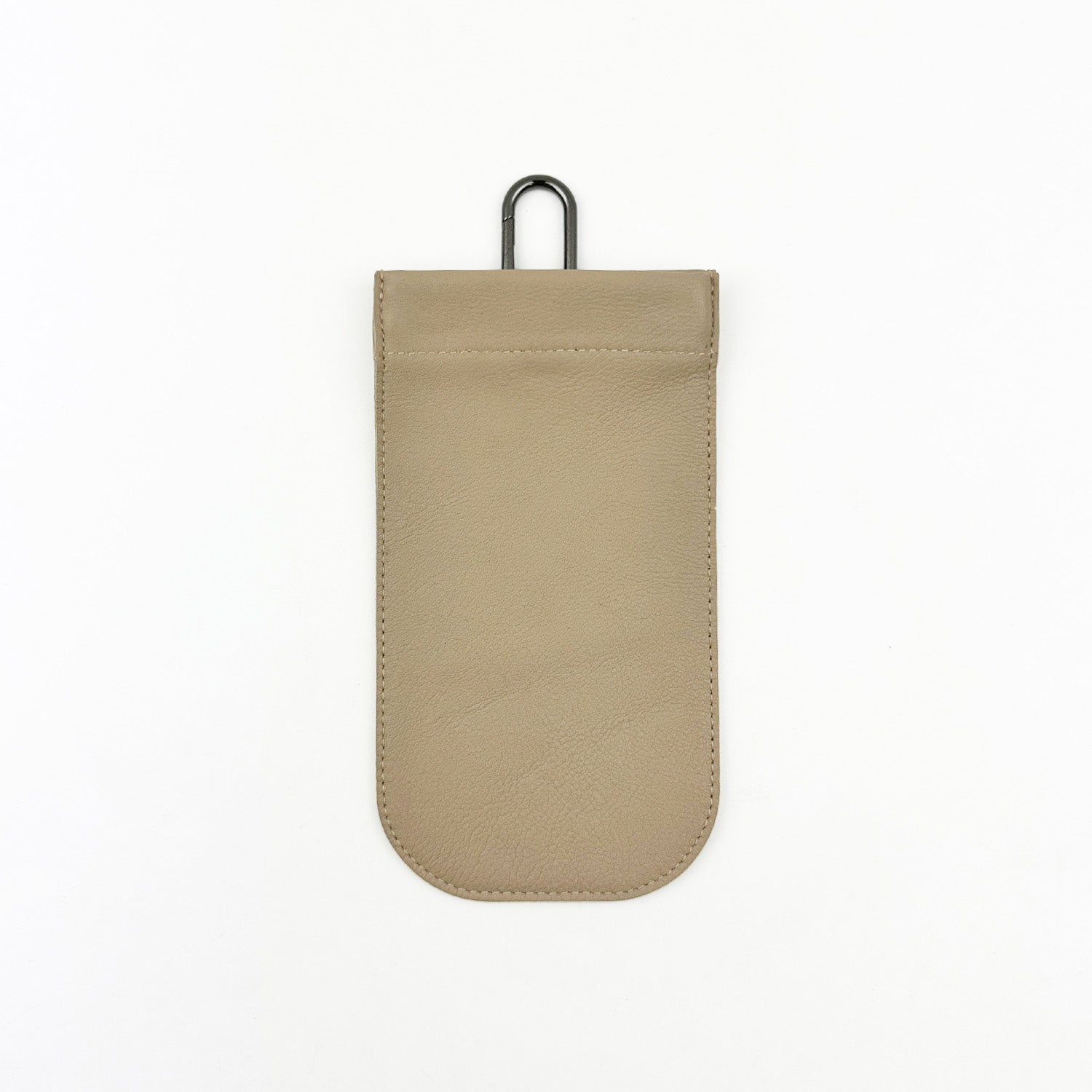 The SUN-GLASS POUCH - SAND by evokewomen features a beige leather exterior, a rectangular flap, and a metal hook at the top. Its unique design makes it perfect for protecting eyewear, and it is showcased against a plain white background.