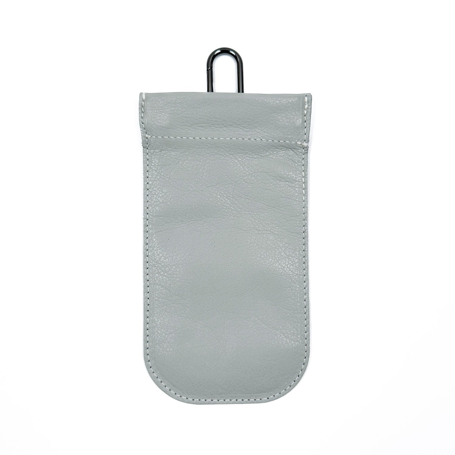 The SUN-GLASS POUCH - LIGHT SMOKE by evokewomen is a stylish gray leather sunglasses holder with a distinct design, featuring a flap closure and metal hook at the top.