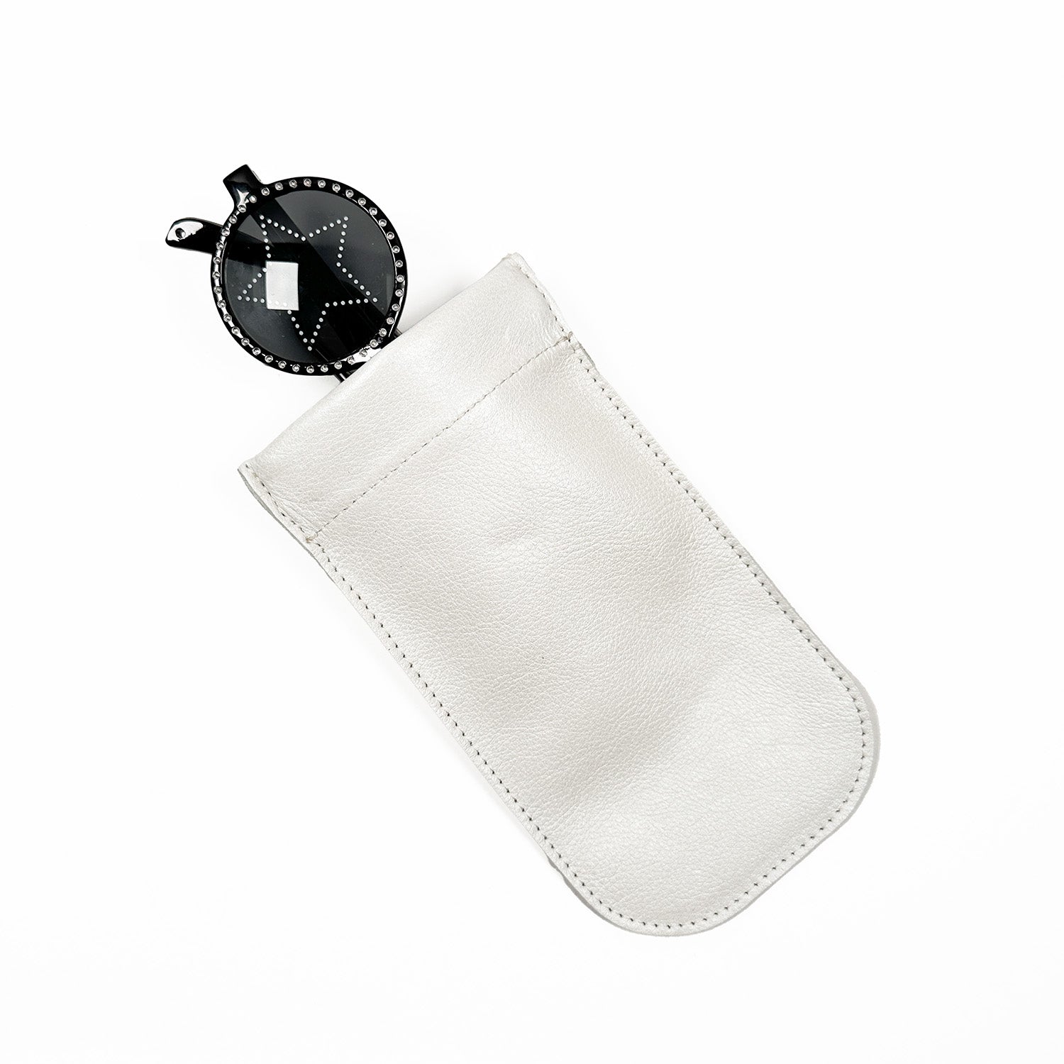 The SUN-GLASS POUCH in pearl white from evokewomen features a sleek black round keychain partially visible inside and boasts a convenient squeeze frame closure, making it perfect as a stylish sunglasses pouch.