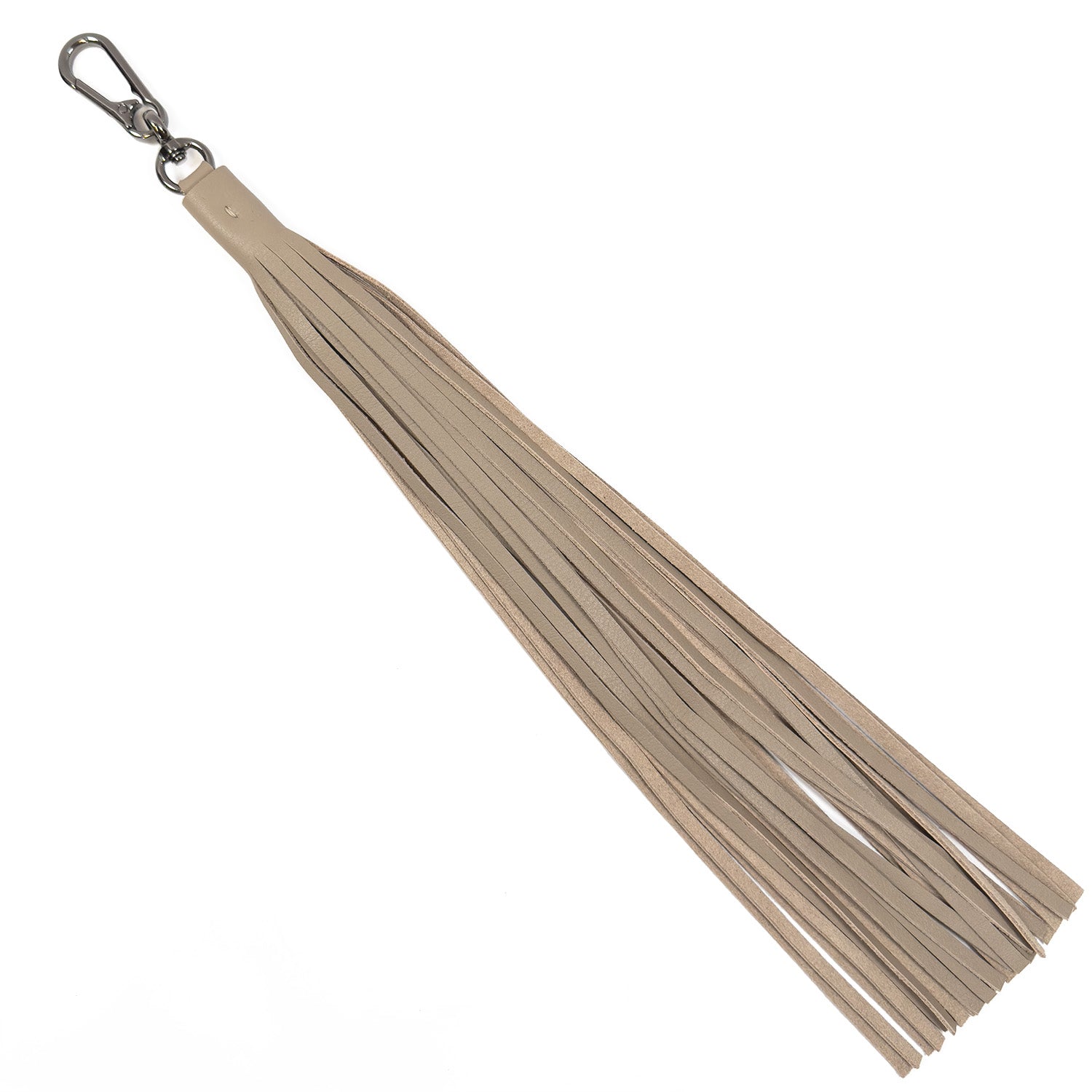 The TASSEL XXL - sand keychain from evokewomen, crafted in beige leather and featuring a metal clasp, is displayed against a white background to highlight its unique design.