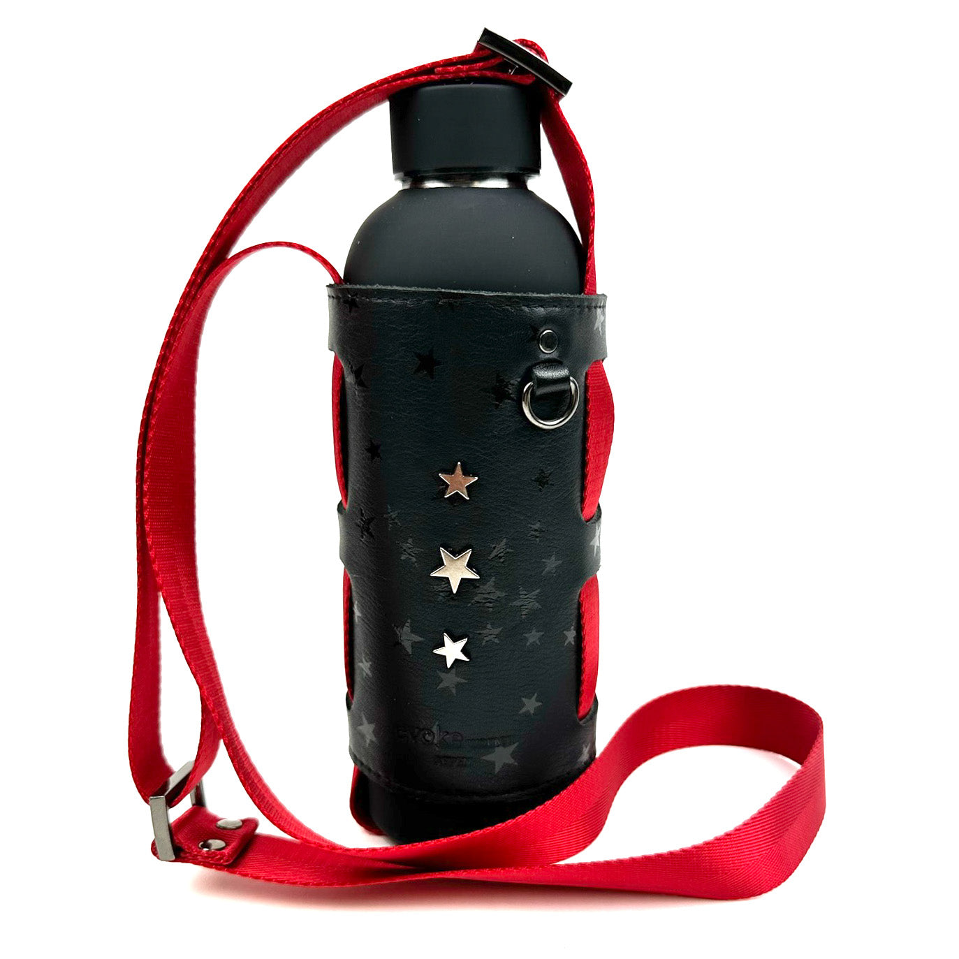 Introducing the "Carrier - black stars" by evokewomen: a stylish bottle carrier crafted from star-printed leather, complete with a red adjustable shoulder strap accented with silver star decorations.