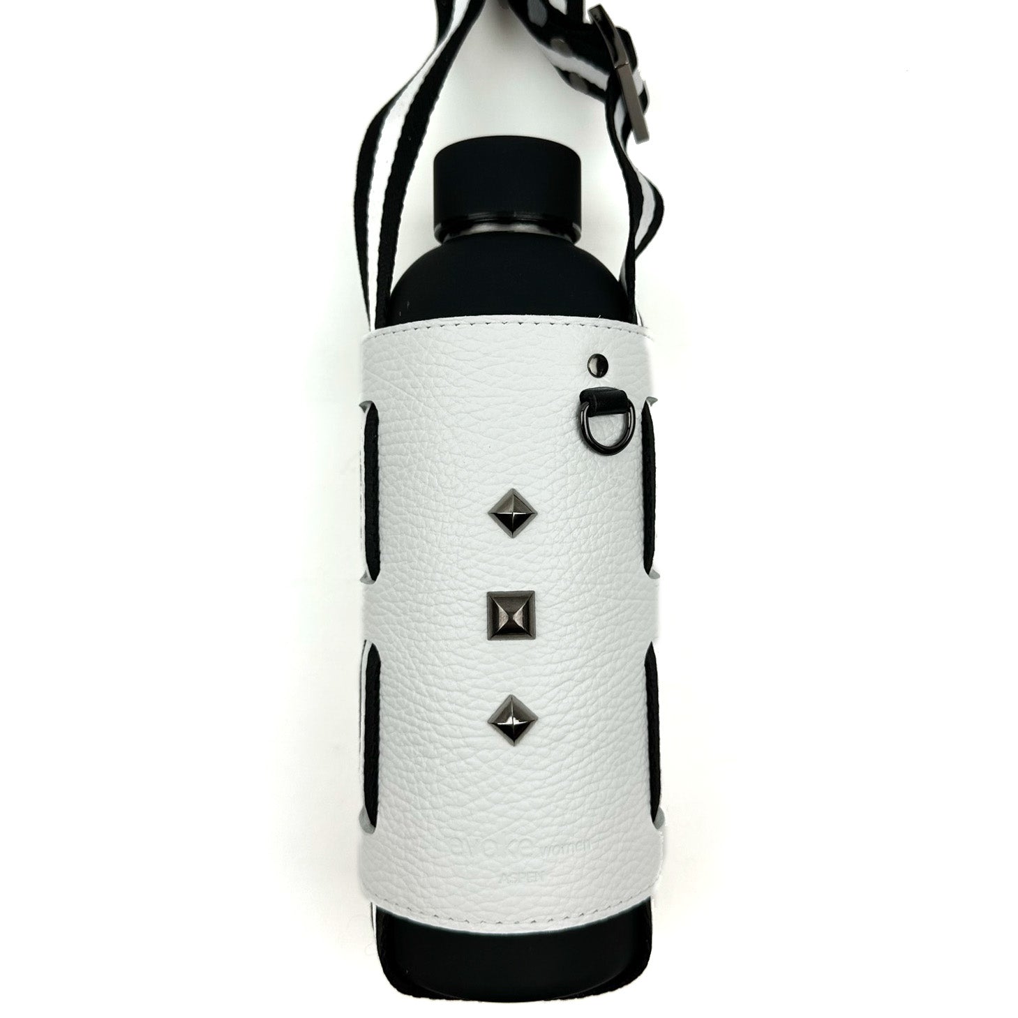 The evokewomen Bottle Carrier in white includes a black bottle nestled in a white leather-textured sleeve, highlighted with three silver studs and equipped with an adjustable shoulder strap for convenient carrying.