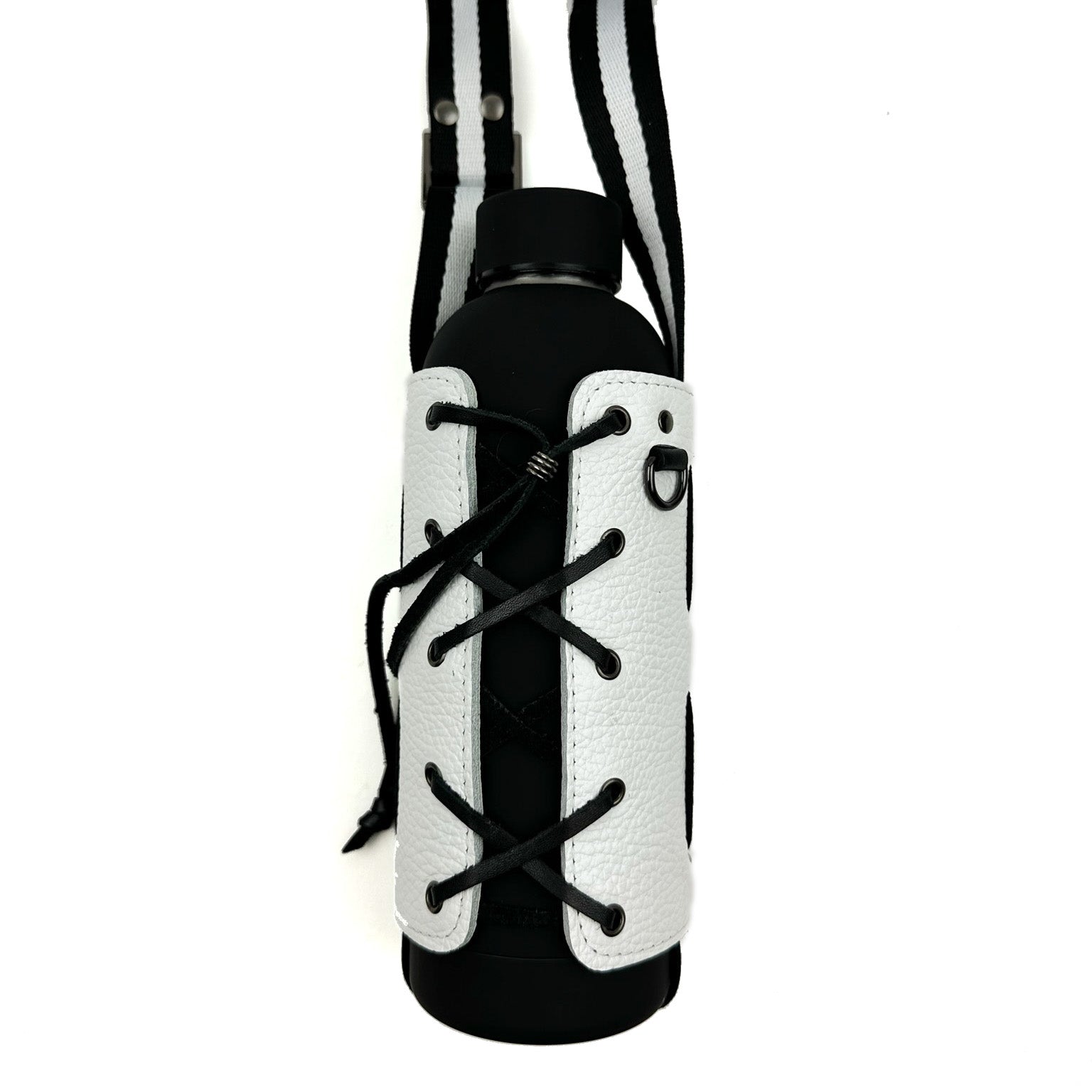 A Bottle Carrier in white from evokewomen, featuring lace-up detailing and an adjustable striped shoulder strap, cradles a black water bottle.