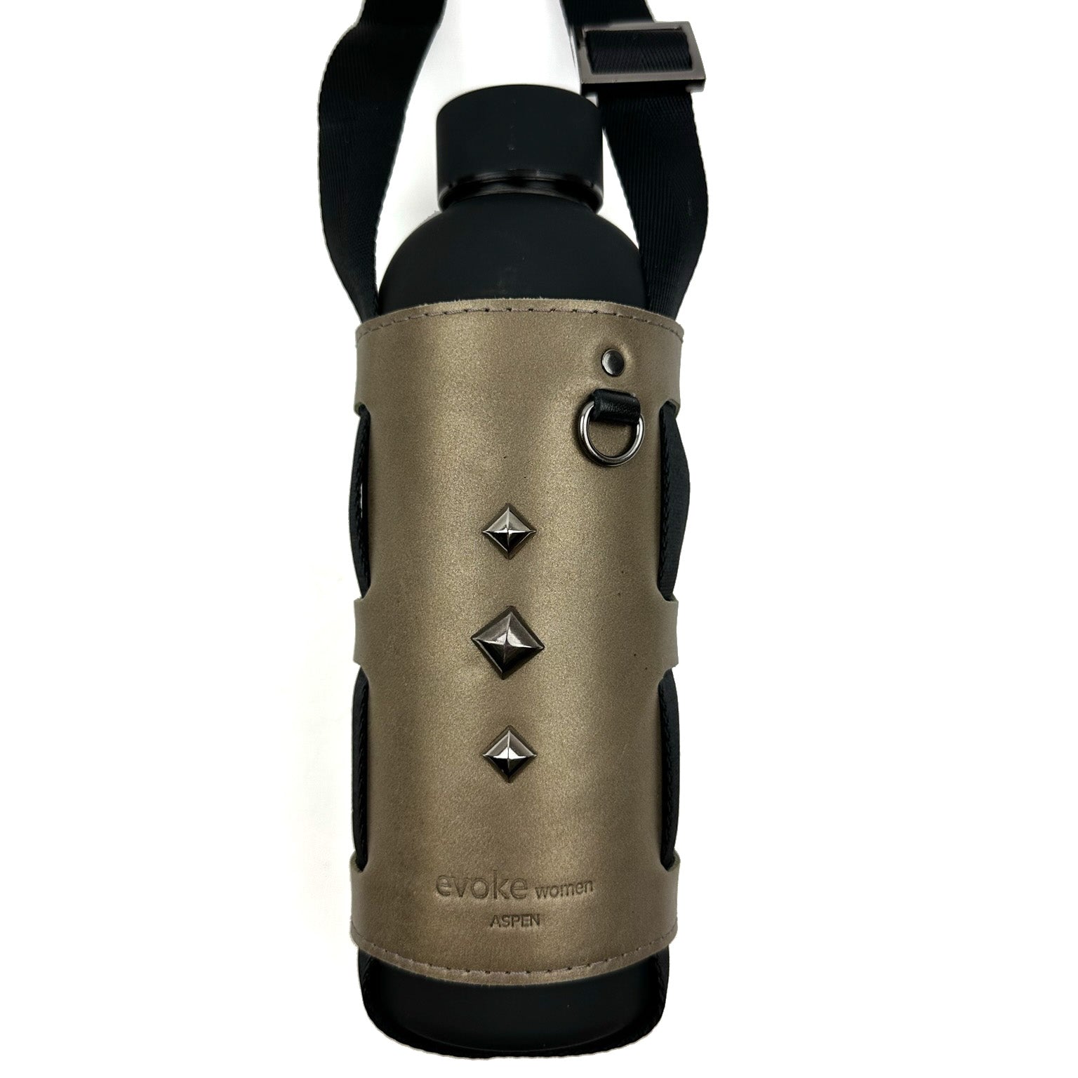 The Bottle Carrier - bronze by evokewomen showcases a sleek black water bottle wrapped in a brown leather holder with a corset-style closure featuring three silver studs and a durable carrying strap. This elegant accessory combines style and functionality, making it ideal for those with an active lifestyle.