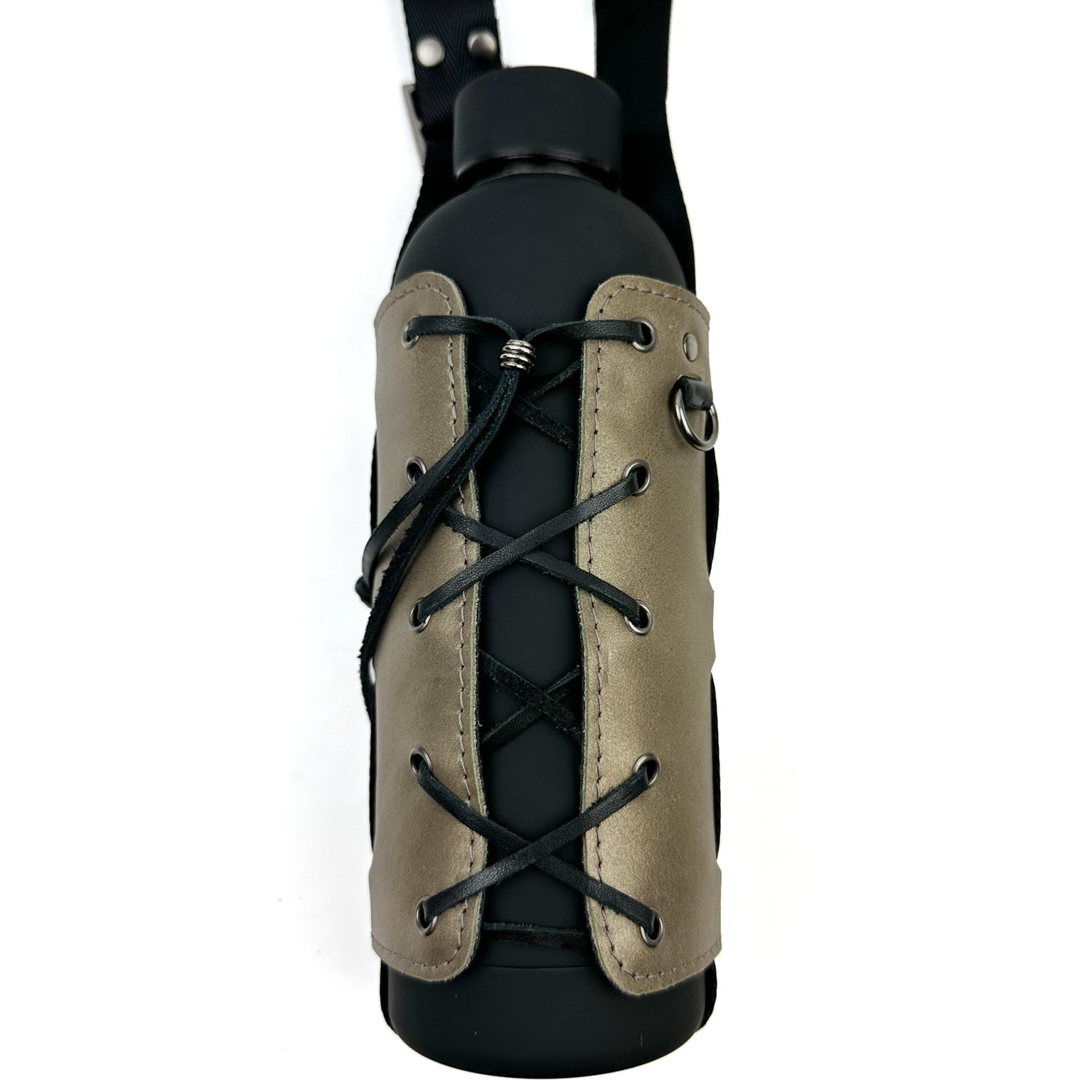 Introducing the Bottle Carrier - bronze by evokewomen, featuring a black bottle holder with a brown leather sleeve. It showcases a corset-style closure with crisscrossed laces and a black strap. Pyramid-shaped rivets elegantly enhance this unique design.