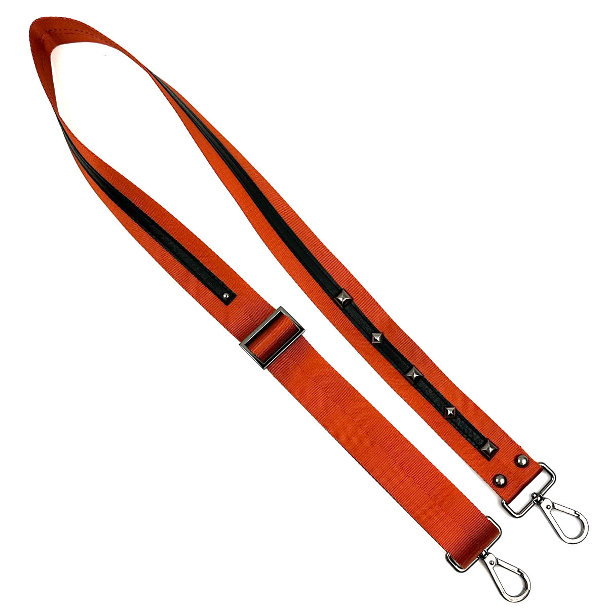 The SHOULDER STRAP - ORANGE by evokewomen features silver clips, black accents, and metal studs crafted from durable nylon webbing for a unique design.