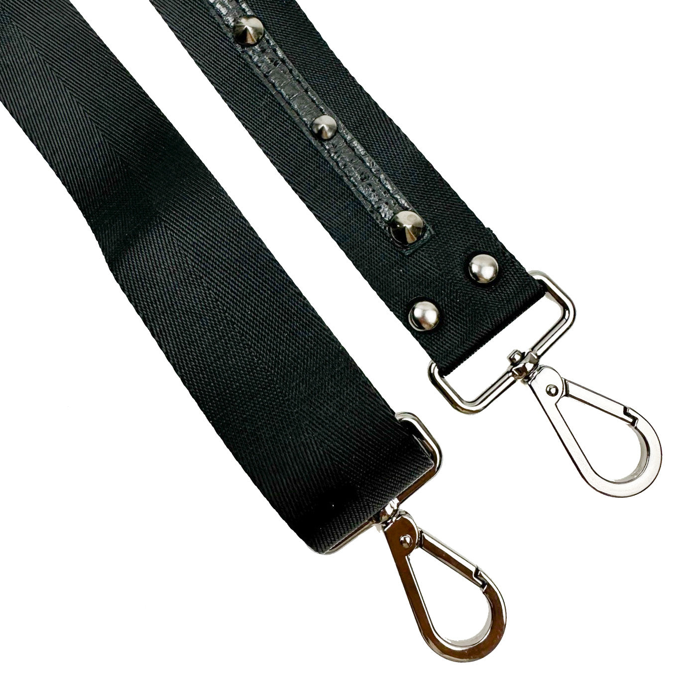 The SHOULDER STRAP - BLACK by evokewomen is crafted from black nylon webbing and includes metal clips, leather embellishments, and studded details on each end for attachment.
