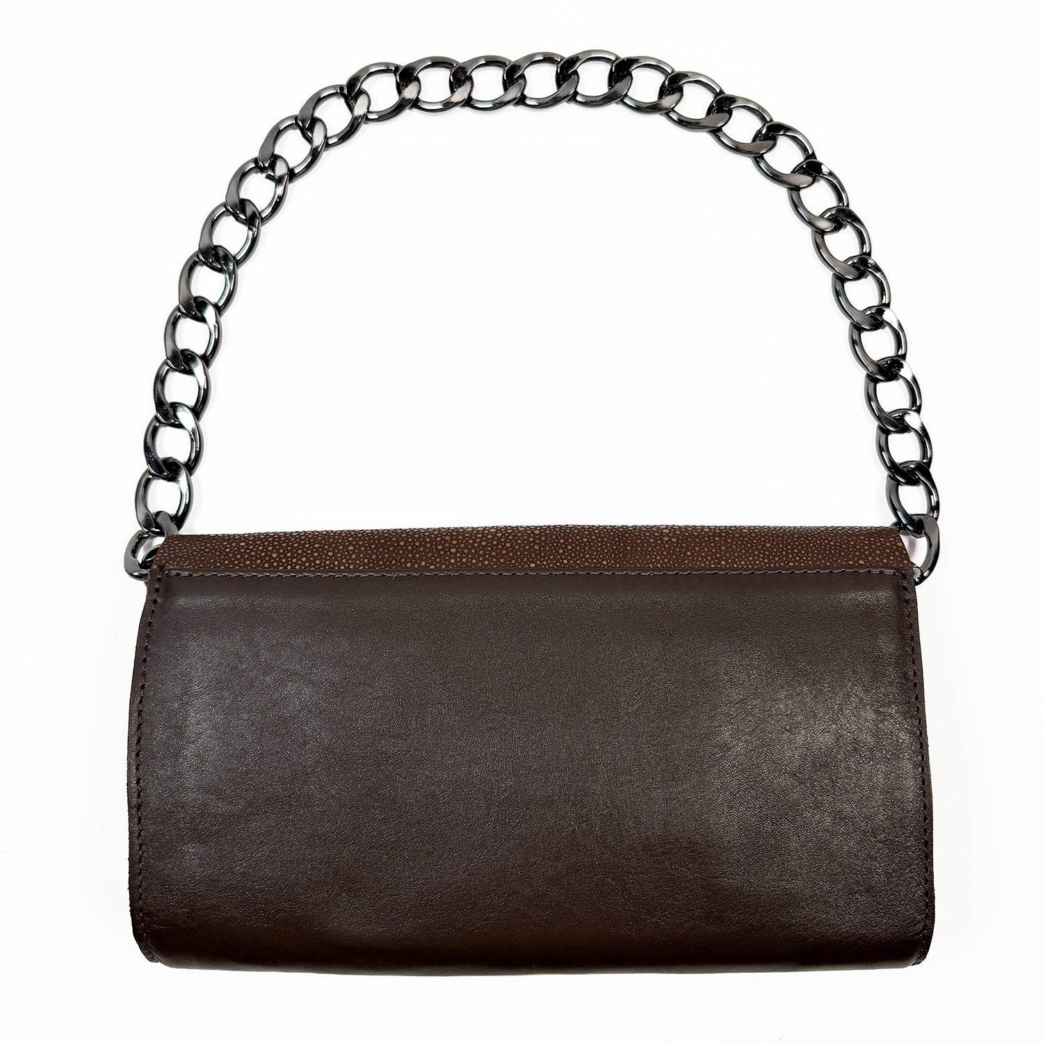 Backside of brownclutch bag with shoulder chain on white background.