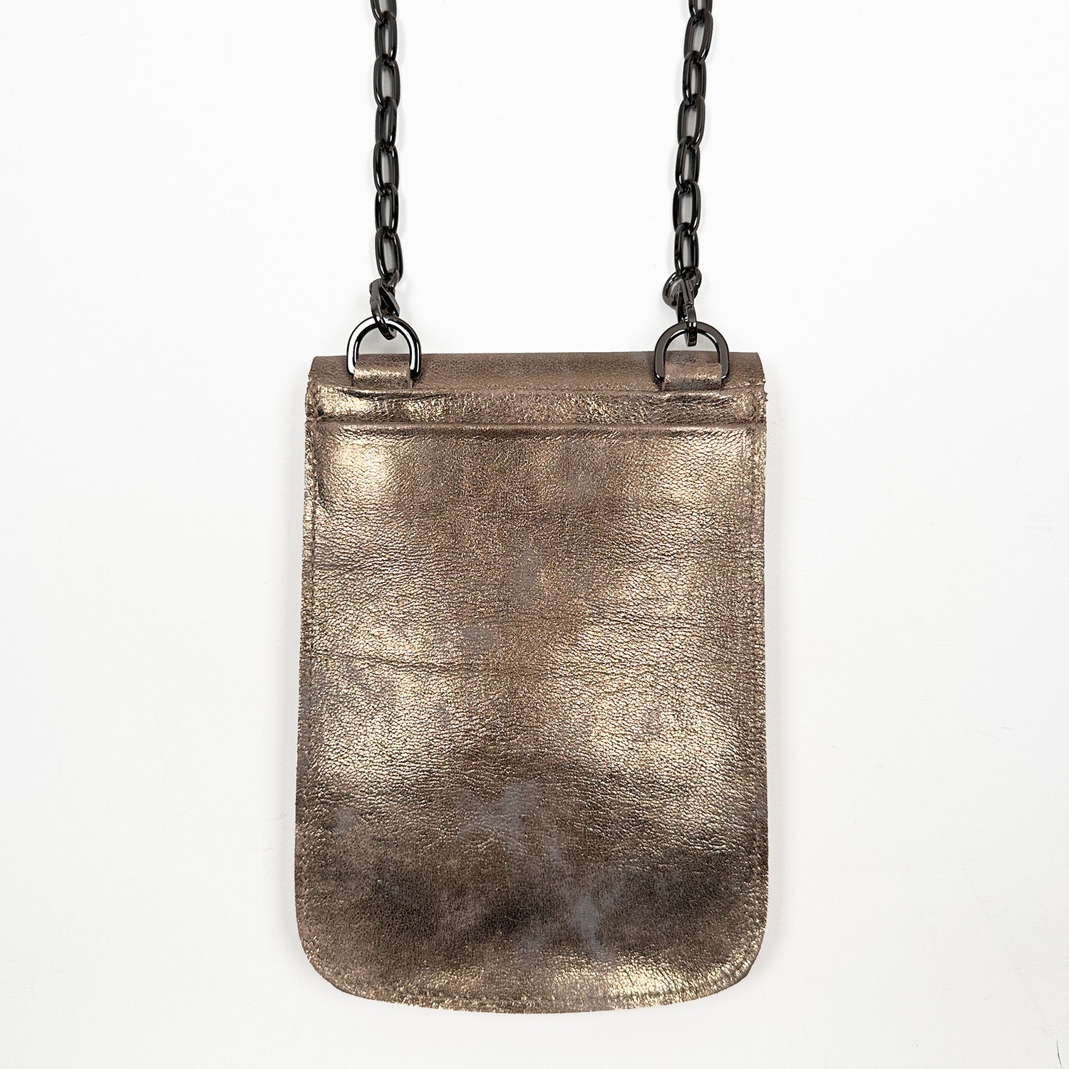 The PAULINA - antique gold by evokewomen is a small rectangular crossbody bag made from metallic Italian leather, adorned with a chic gunmetal chain strap hanging elegantly against a pristine white background—a true festival essential.