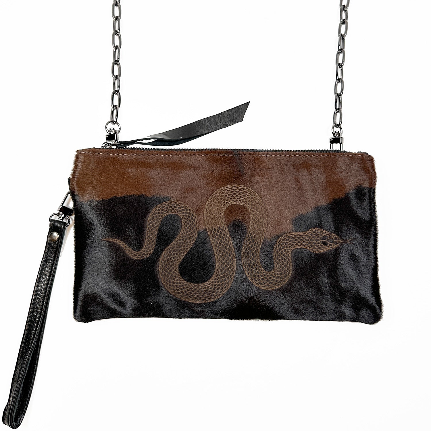 The VICTORIA - black & brown - laser snake by evokewomen is a chic crossbody purse with a chain strap, featuring an elegant snake design on textured material.