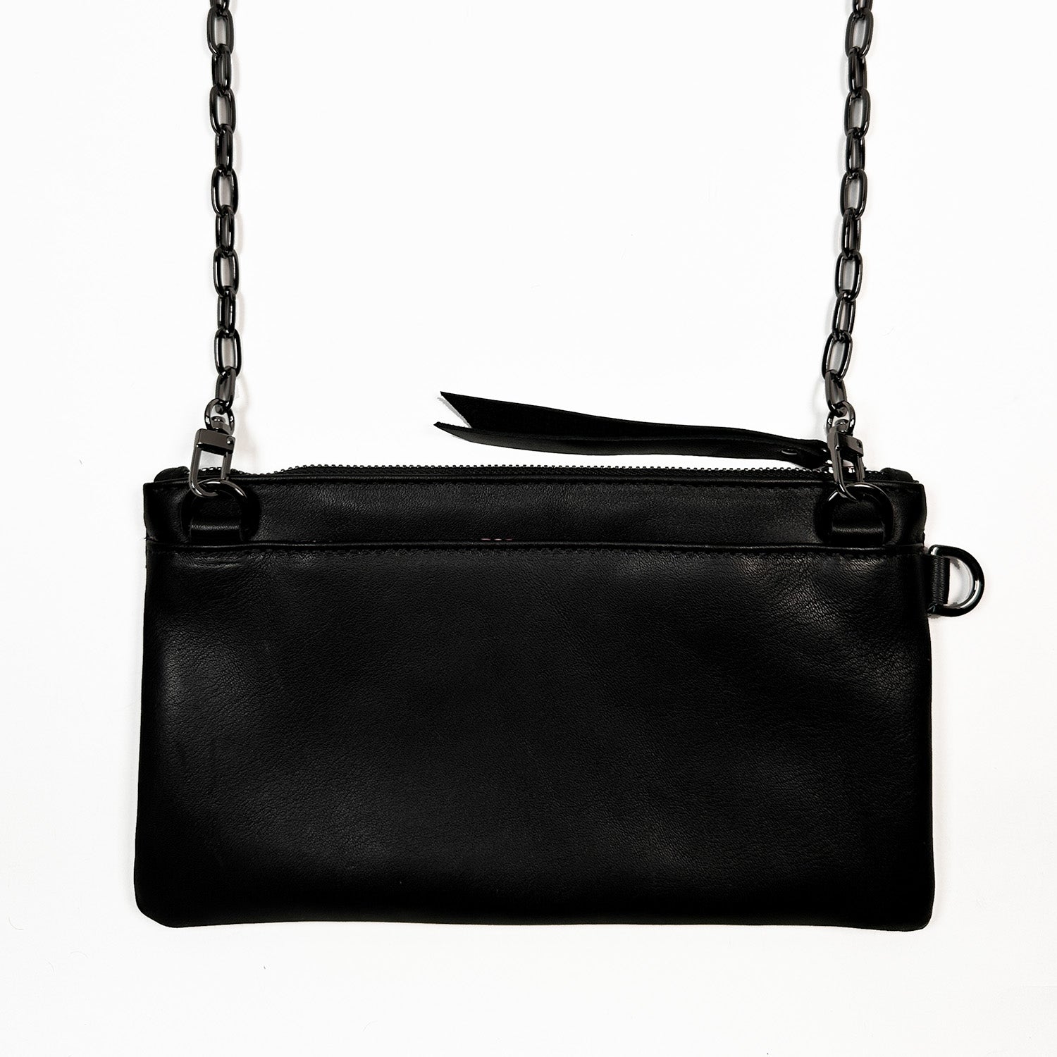 The Victoria Bag in black snake-embossed leather by Evoke Women, featuring a striking agate decoration. This versatile accessory can be worn as a crossbody, belt bag, or wristlet, showcasing a sleek design that transitions effortlessly from day to night.