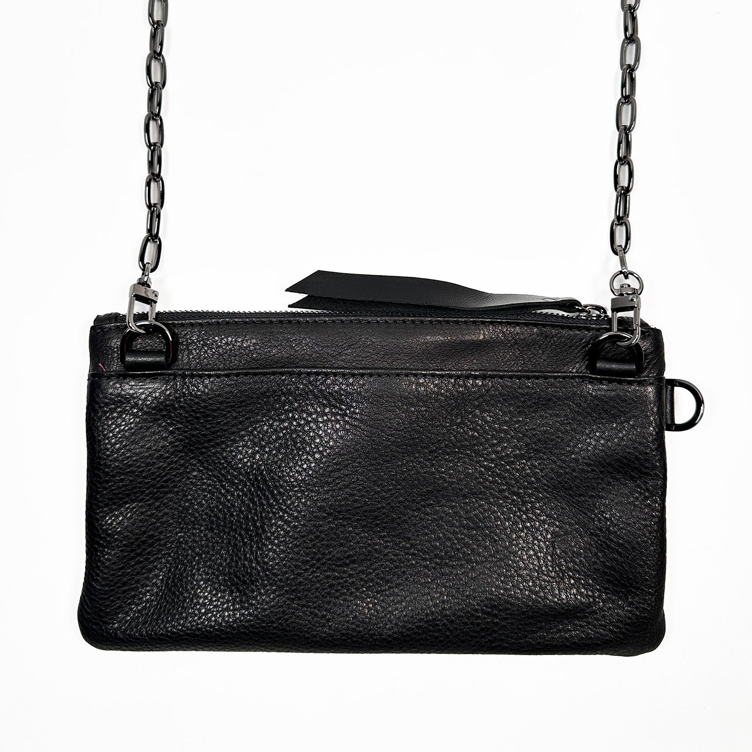 The Victoria Bag in black Italian leather by Evoke Women, featuring a striking agate decoration. This versatile accessory can be worn as a crossbody, belt bag, or wristlet, showcasing a sleek design that transitions effortlessly from day to night.