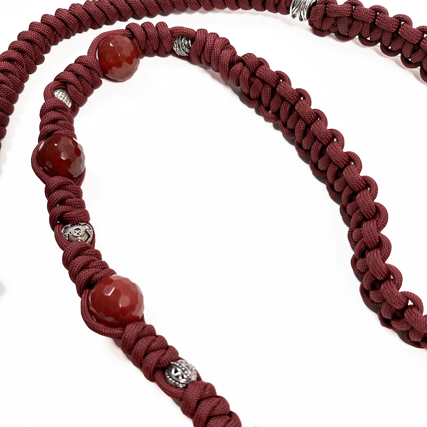 Wine-colored knotted shoulder strap by evokewomen, featuring red faceted Agate beads and gunmetal decorative elements.